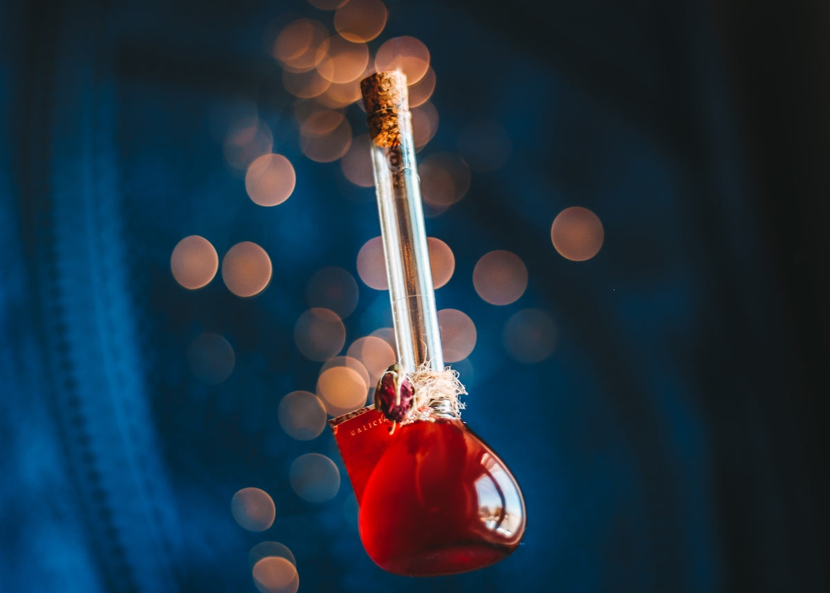 A red potion bottle floats against a blue background.