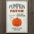 Halloween-themed sign with a pumpkin and text on a wooden background